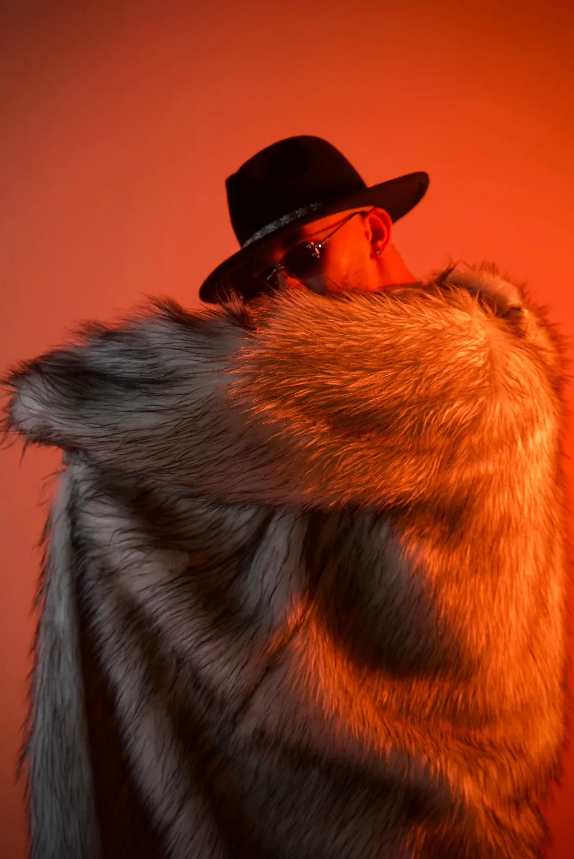 ASHI in a fur coat under red light