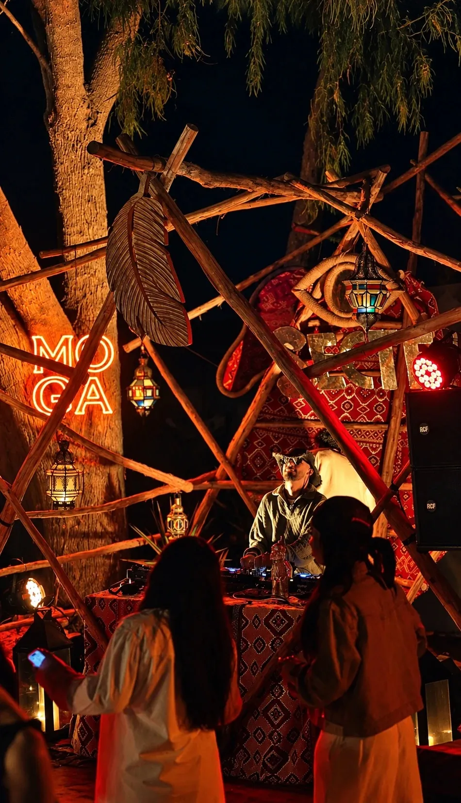 ASHI at the decks beside the MOGA neon