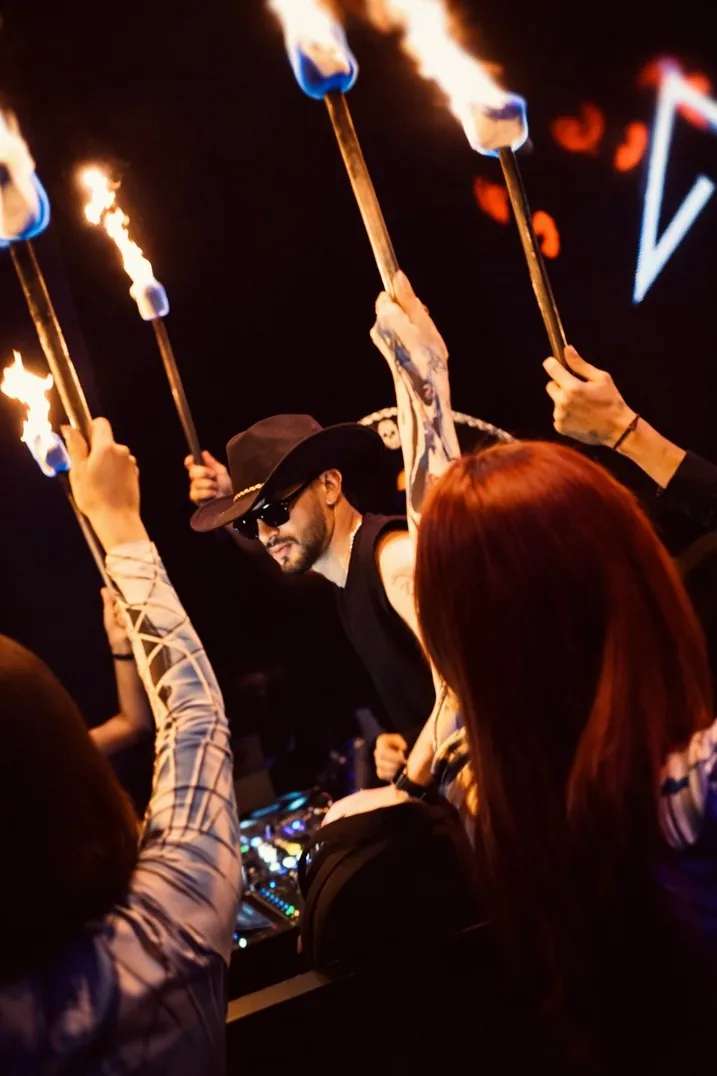 Torches raised above the dancefloor